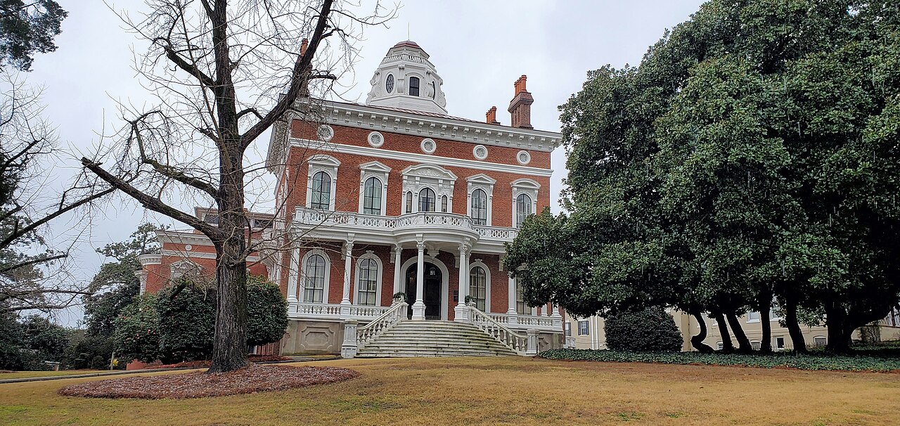 The brick and white-trimmed facade of Hay House in Macon.