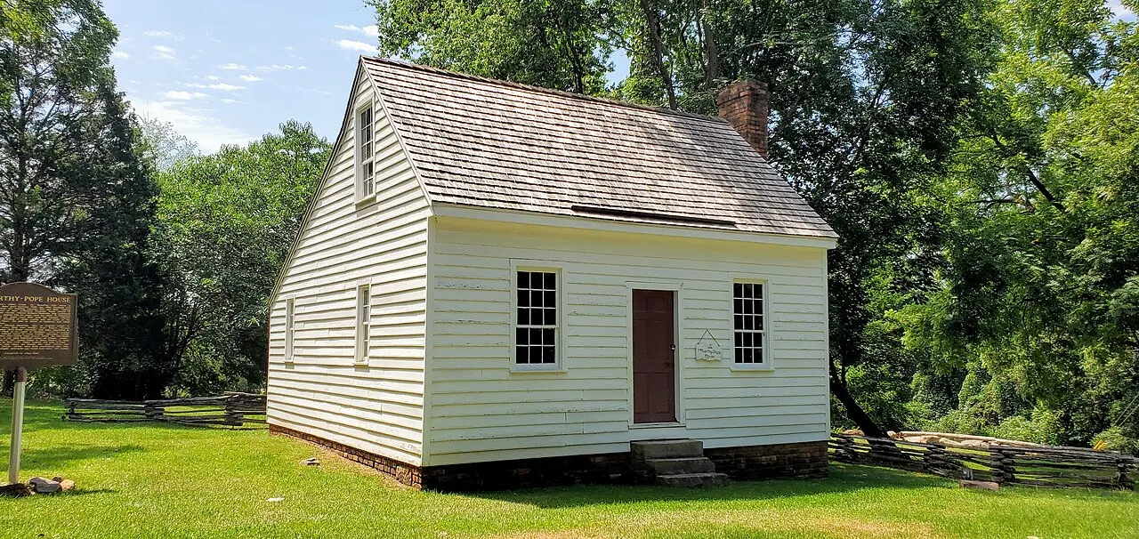 The small pale clapboard McCarthy-Pope House in the Old Clinton Historic District near Gray.