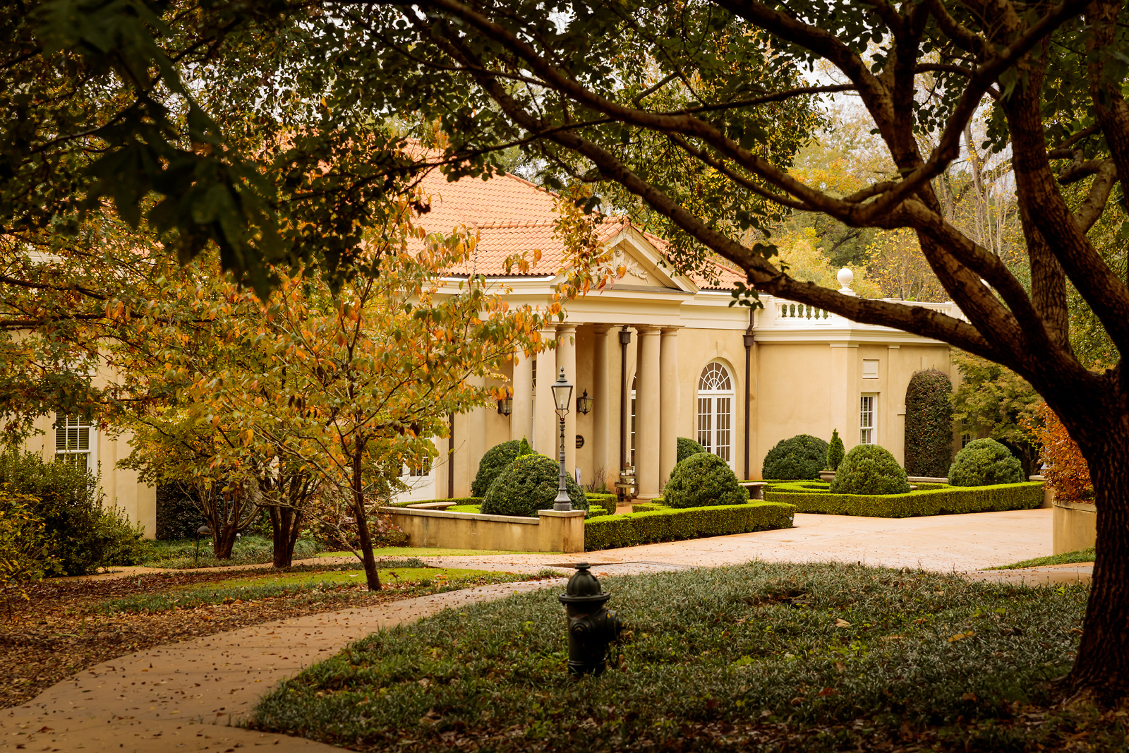 Estate building and formal boxwood gardens at Hills & Dales in LaGrange.