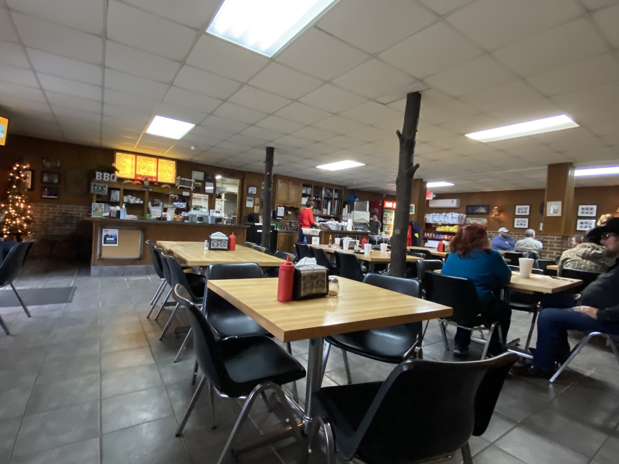 Dining room, counter and rustic timber posts inside Scott's BBQ in Cochran.