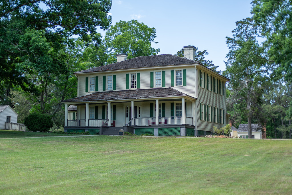 Liberty Hall, a two-story white historic home with green shutters, at A.H. Stephens State Park.
