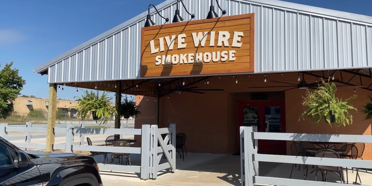 Signed entrance and covered patio at Live Wire Smokehouse in Wrens.