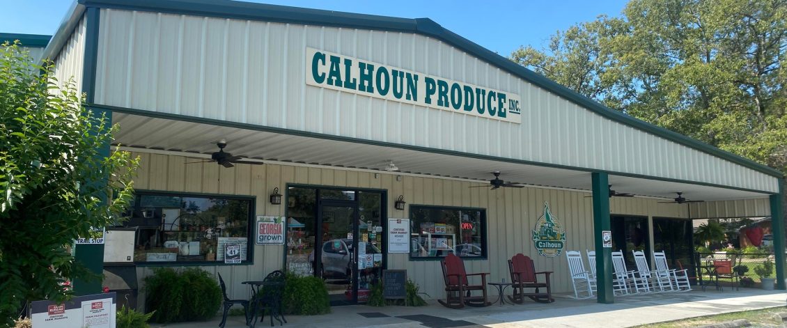 Calhoun Produce's signed cream-colored farm store and covered porch near Ashburn.