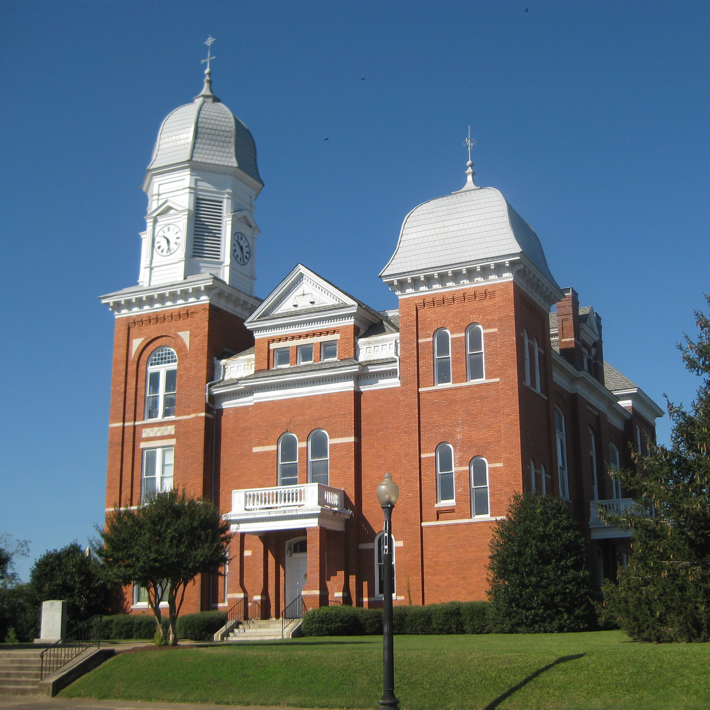 The red-brick Taliaferro County Courthouse and its two ornate towers in Crawfordville.