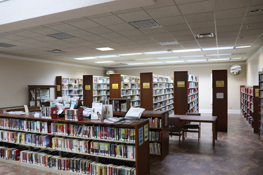 Bookshelves, reading tables and displays inside Warren County Library.