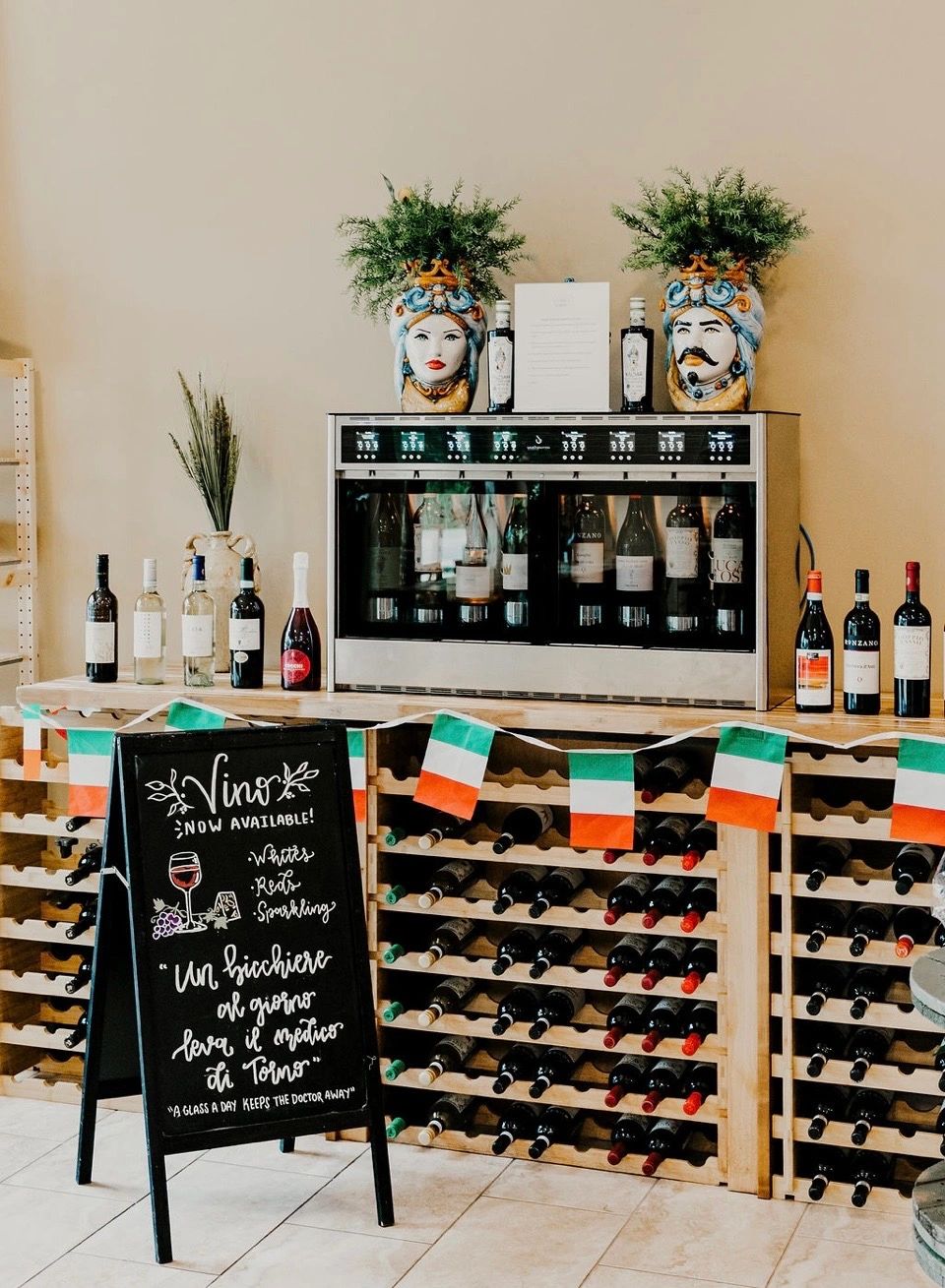 Wine dispenser, bottle racks and Italian decorations inside Ciao Bella Market.