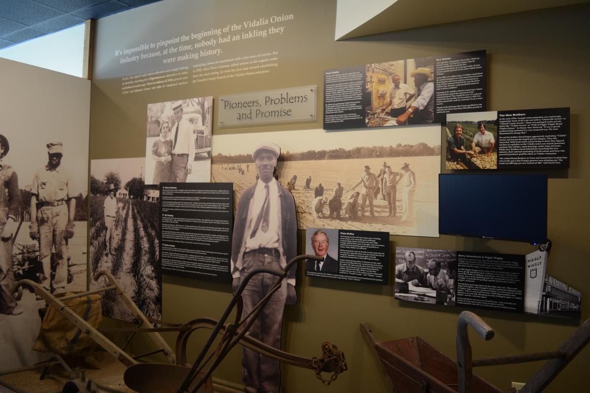 Historical farming displays and equipment inside the Vidalia Onion Museum.
