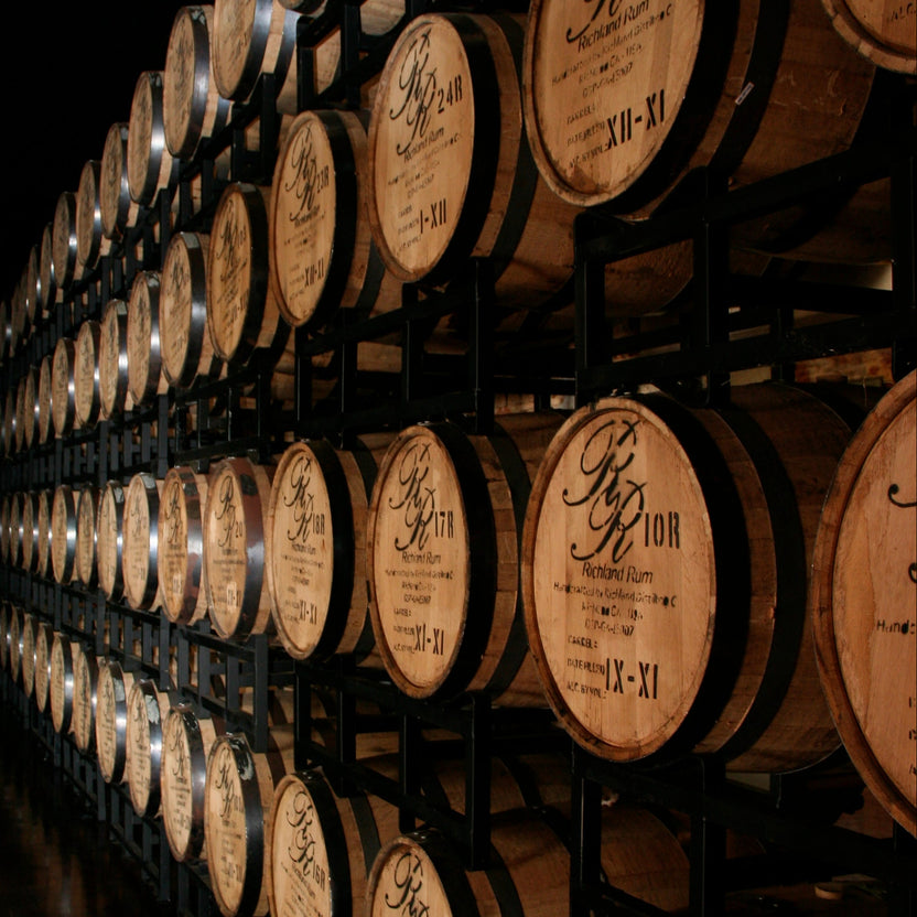 Rows of Richland Rum barrels inside a barrel house in Richland, Georgia.