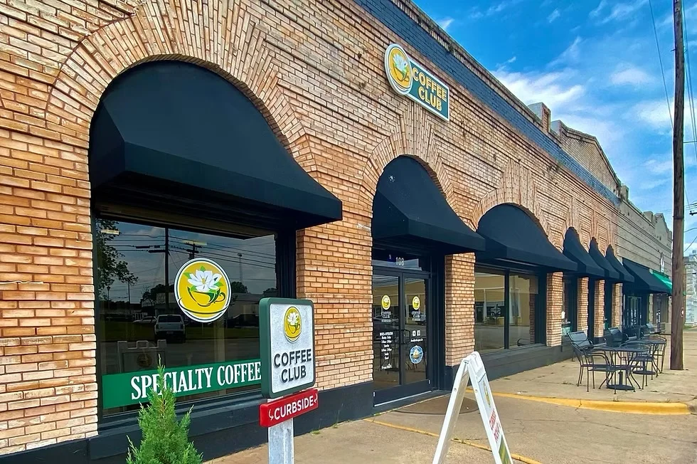 Coffee Club Southern Kitchen's brick storefront, awnings and sidewalk tables in downtown Buena Vista.