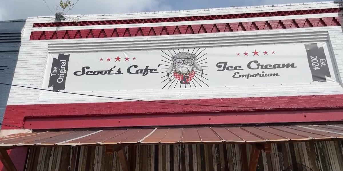 Scoot's Café & Ice Cream Emporium sign on its red-and-white Tennille storefront.