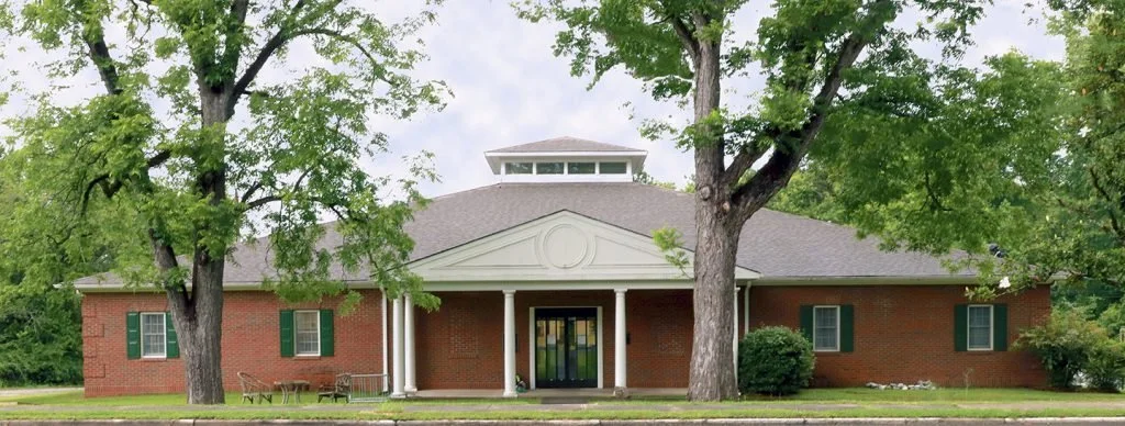 The brick facade and entrance of Sparta-Hancock County Library.