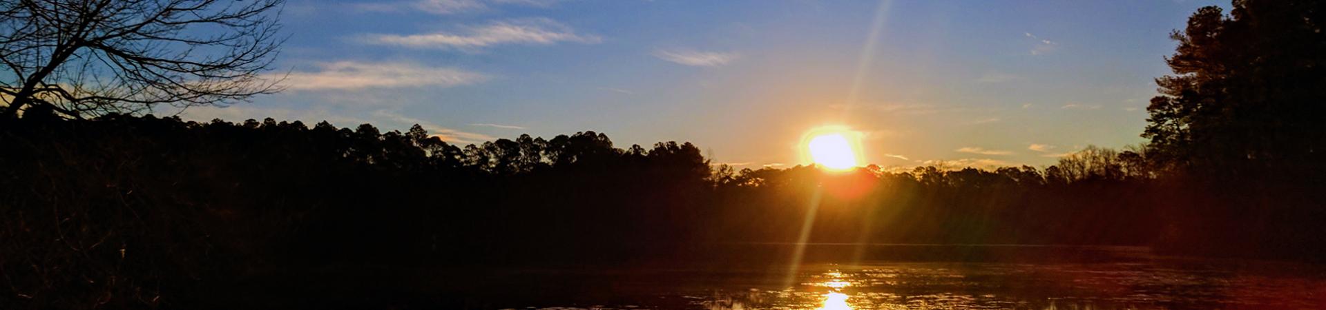 Sunset reflected across the small lake at Jack Hill State Park.