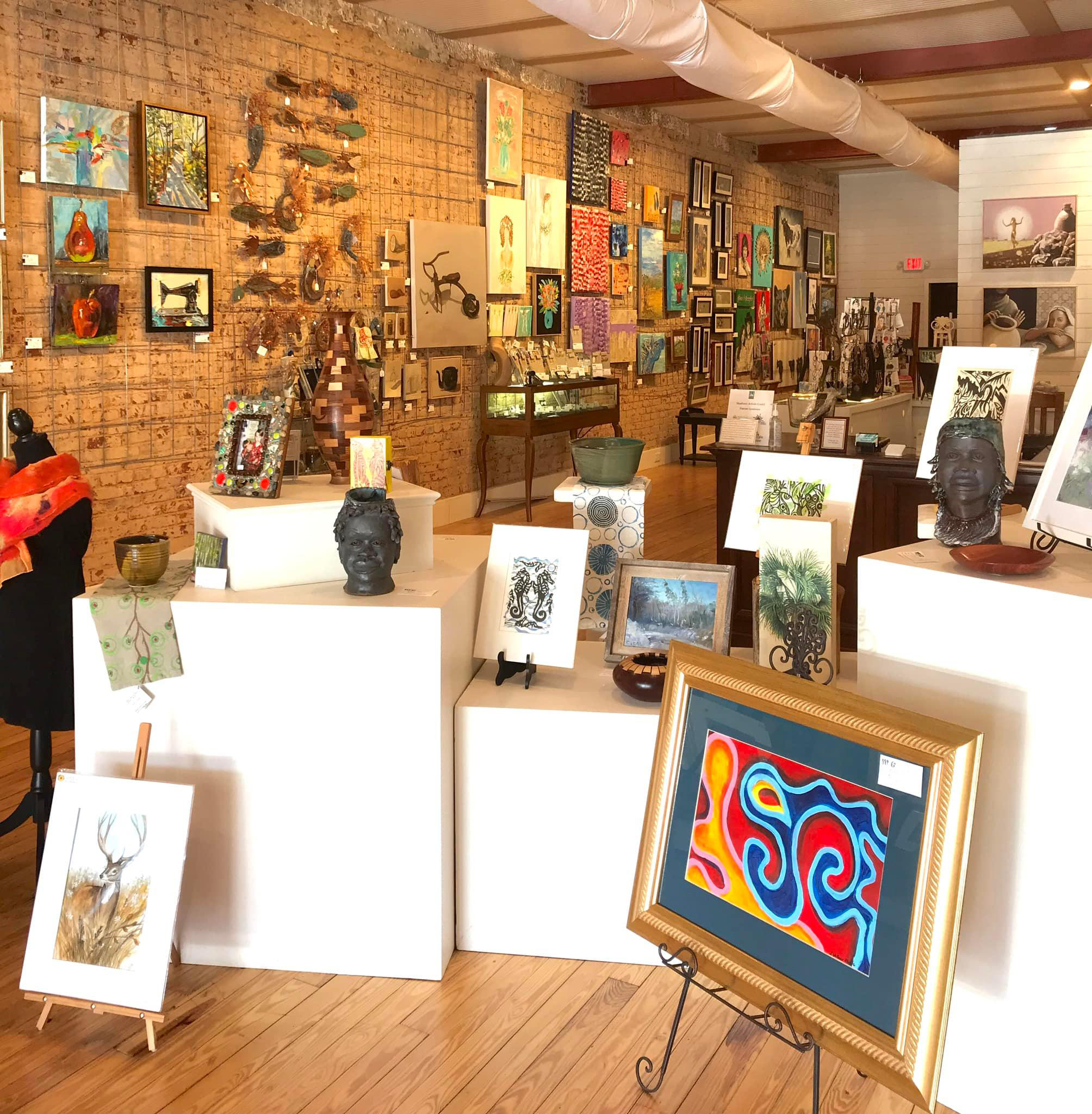 Paintings, pottery, sculpture and other handmade artwork displayed inside MAGallery.