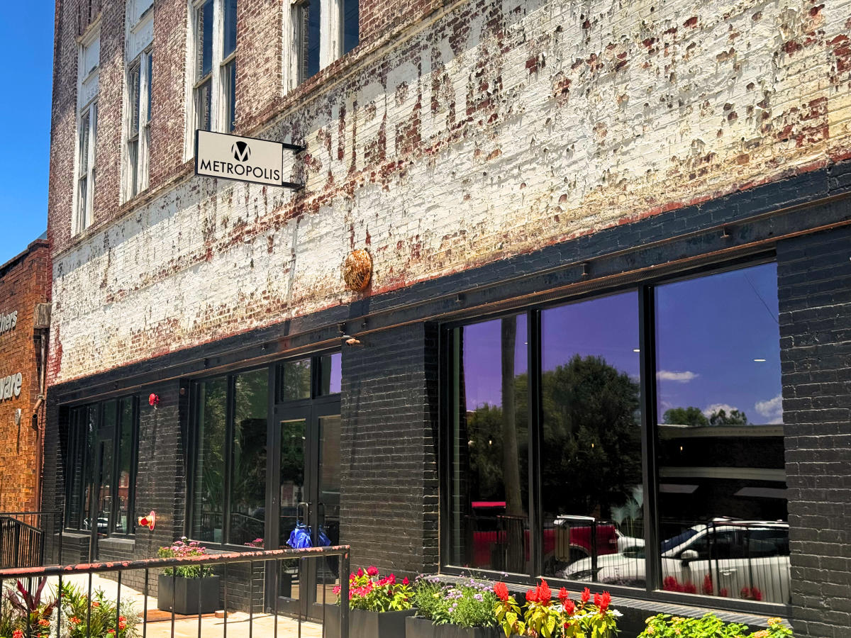 Metropolis Cafe's signed brick storefront at its current Milledgeville location.