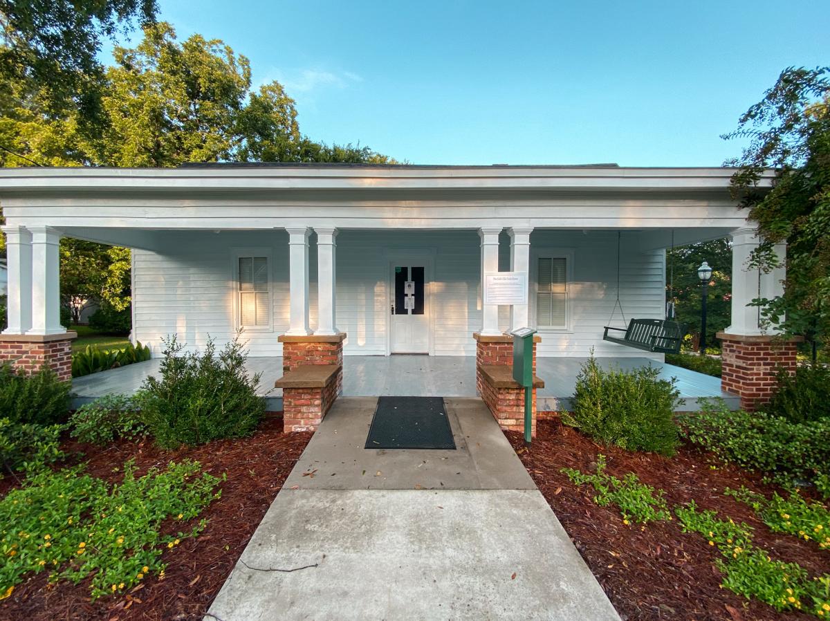 The white two-story Sallie Ellis Davis House seen from its lawn.