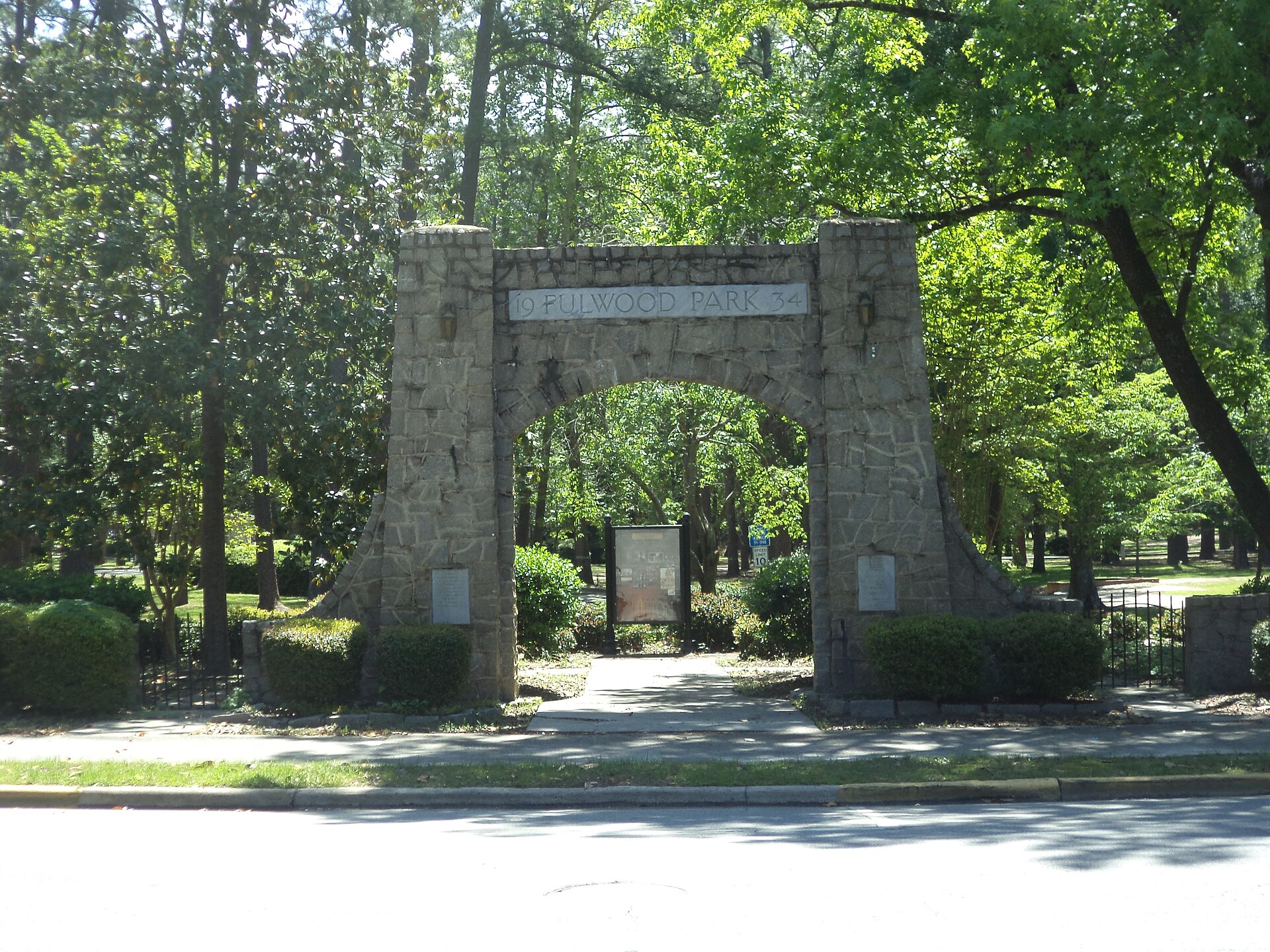 The stone entrance arch and shaded trees at Fulwood Park in Tifton.