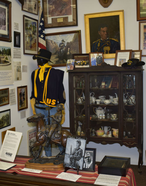 Buffalo Soldier uniform, cavalry sculpture and Henry O. Flipper displays inside the Jack Hadley Black History Museum.