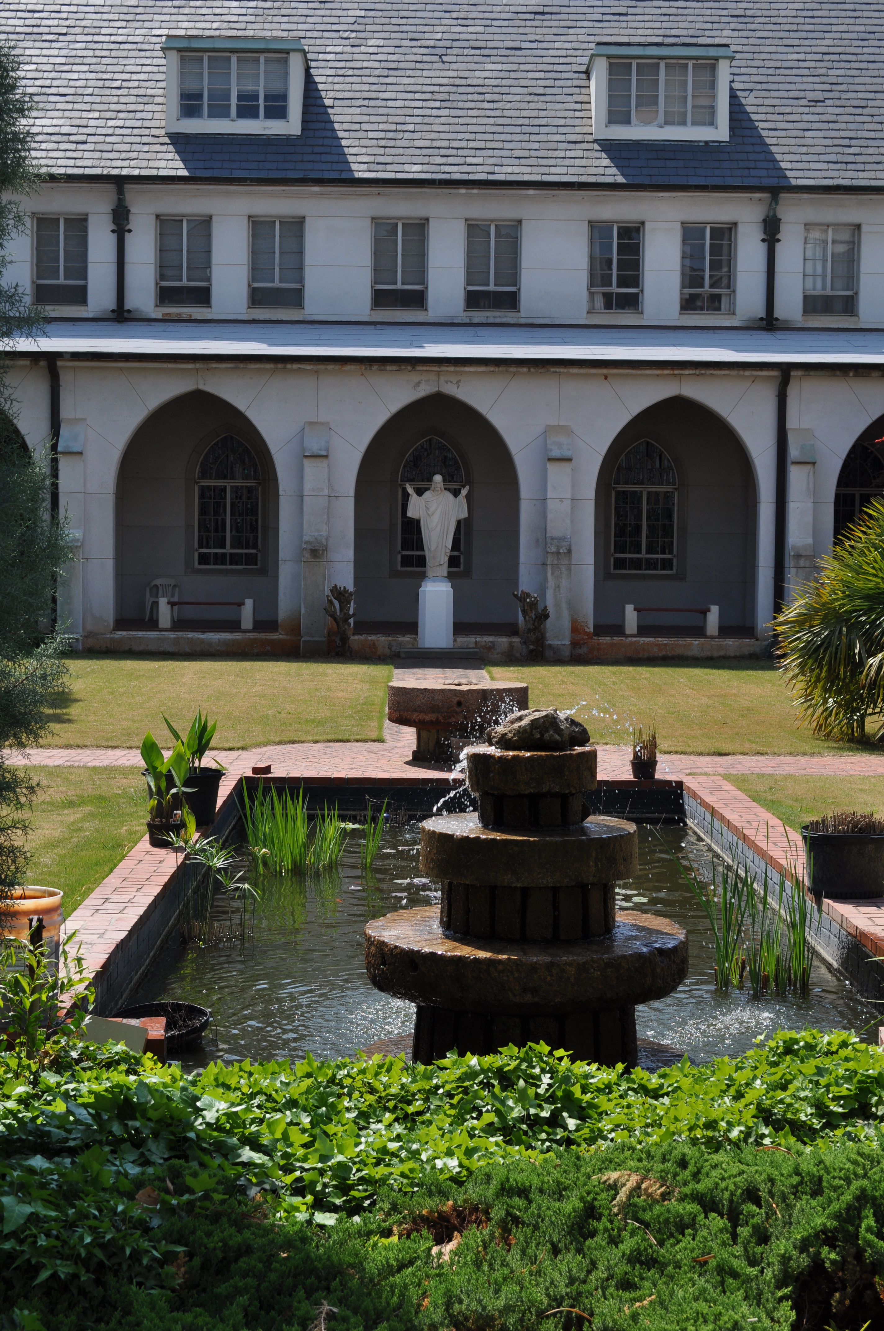 The cloister garden, reflection pool and Gothic arcade at the Monastery of the Holy Spirit.