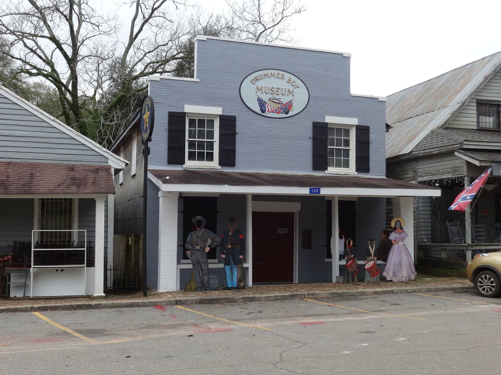 The gray-blue Drummer Boy Museum storefront with museum sign and period-uniform cutouts.