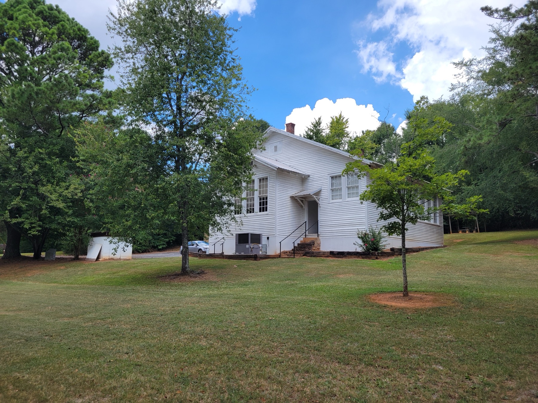 The white clapboard Noble Hill Rosenwald School building in Cassville.