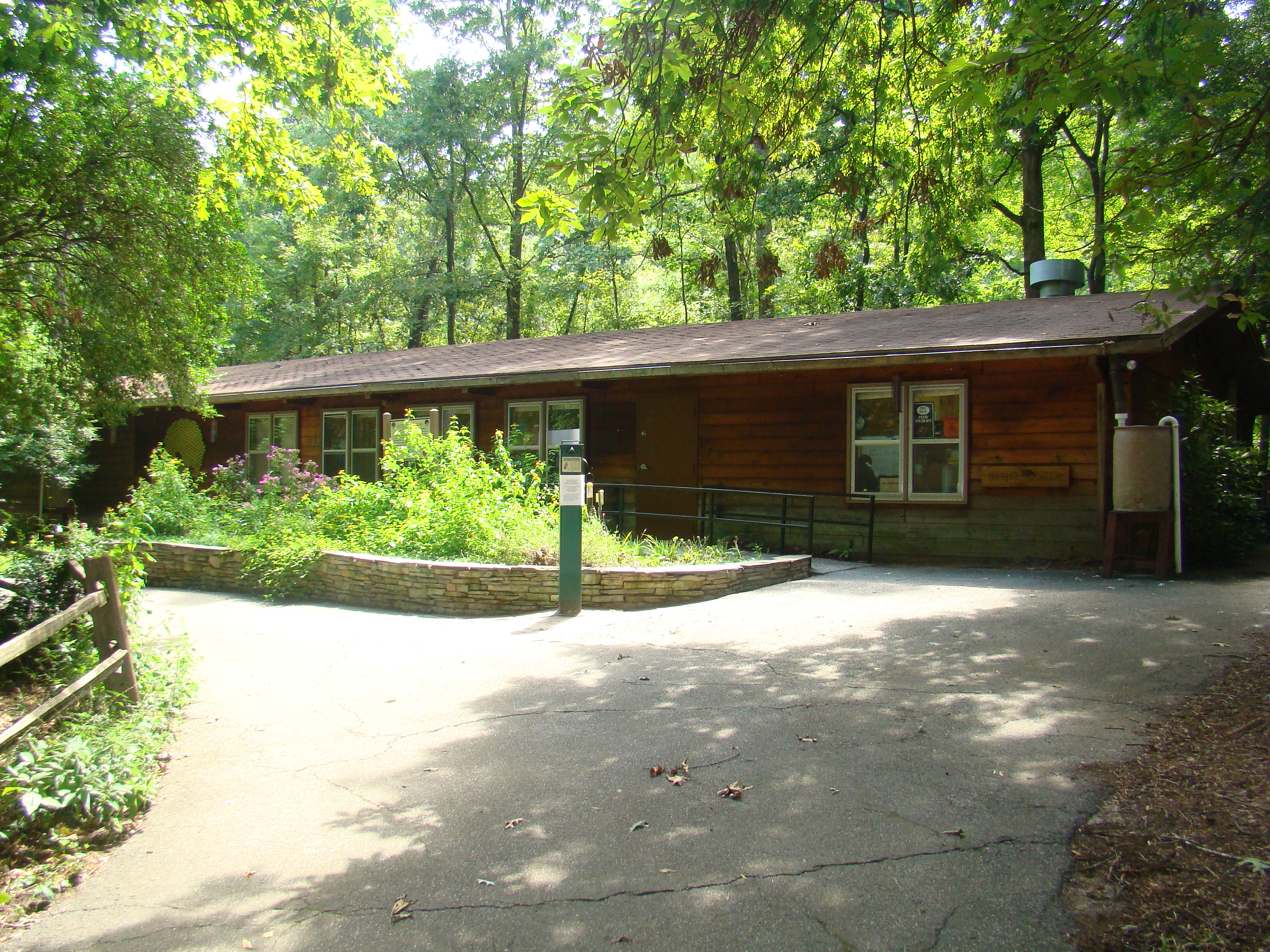 The wooded entrance and accessible ramp at the Reynolds Nature Preserve nature center.