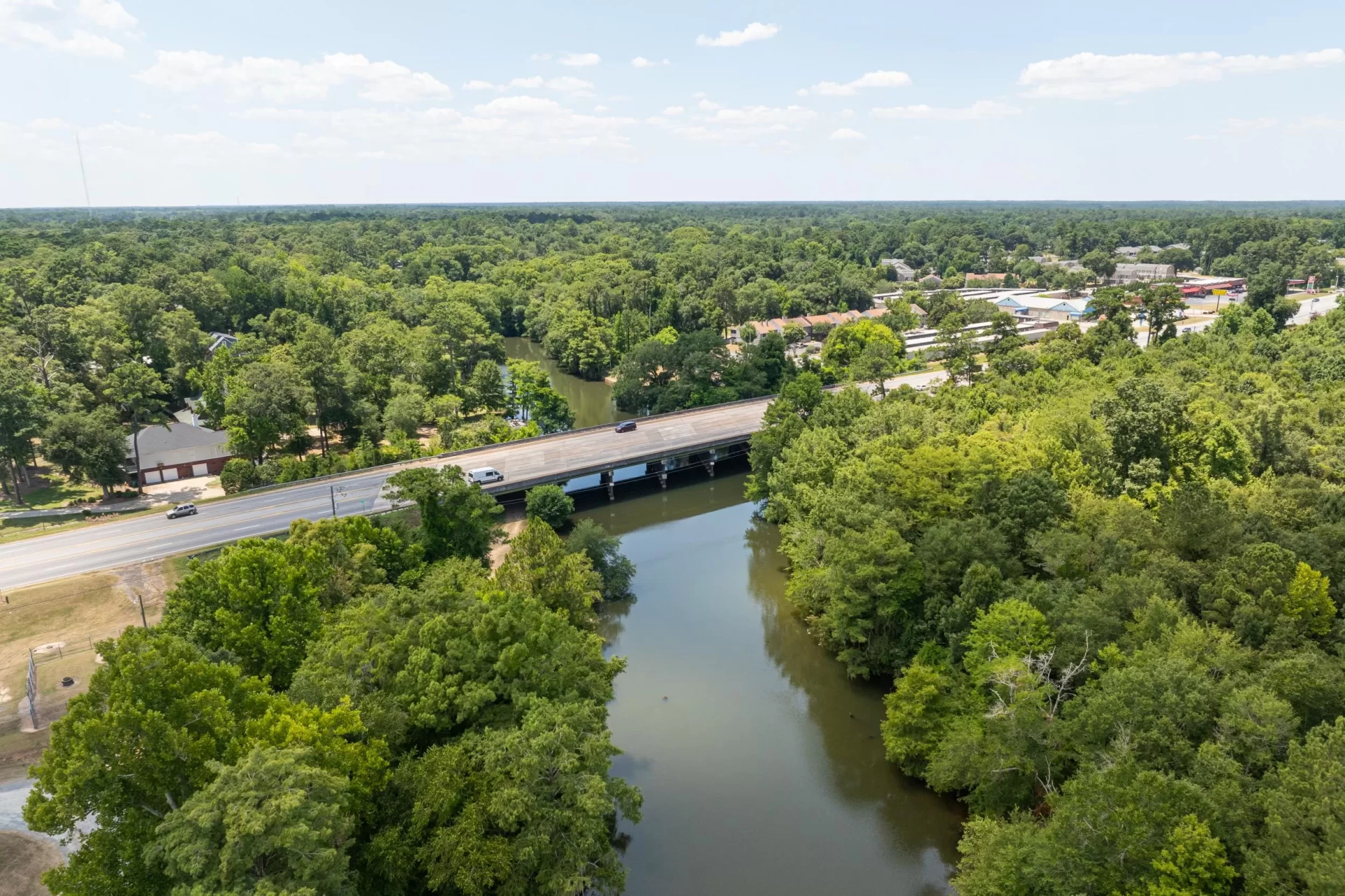 An aerial view of Muckalee Creek, US 19 and the wooded Sutton's Landing access area.