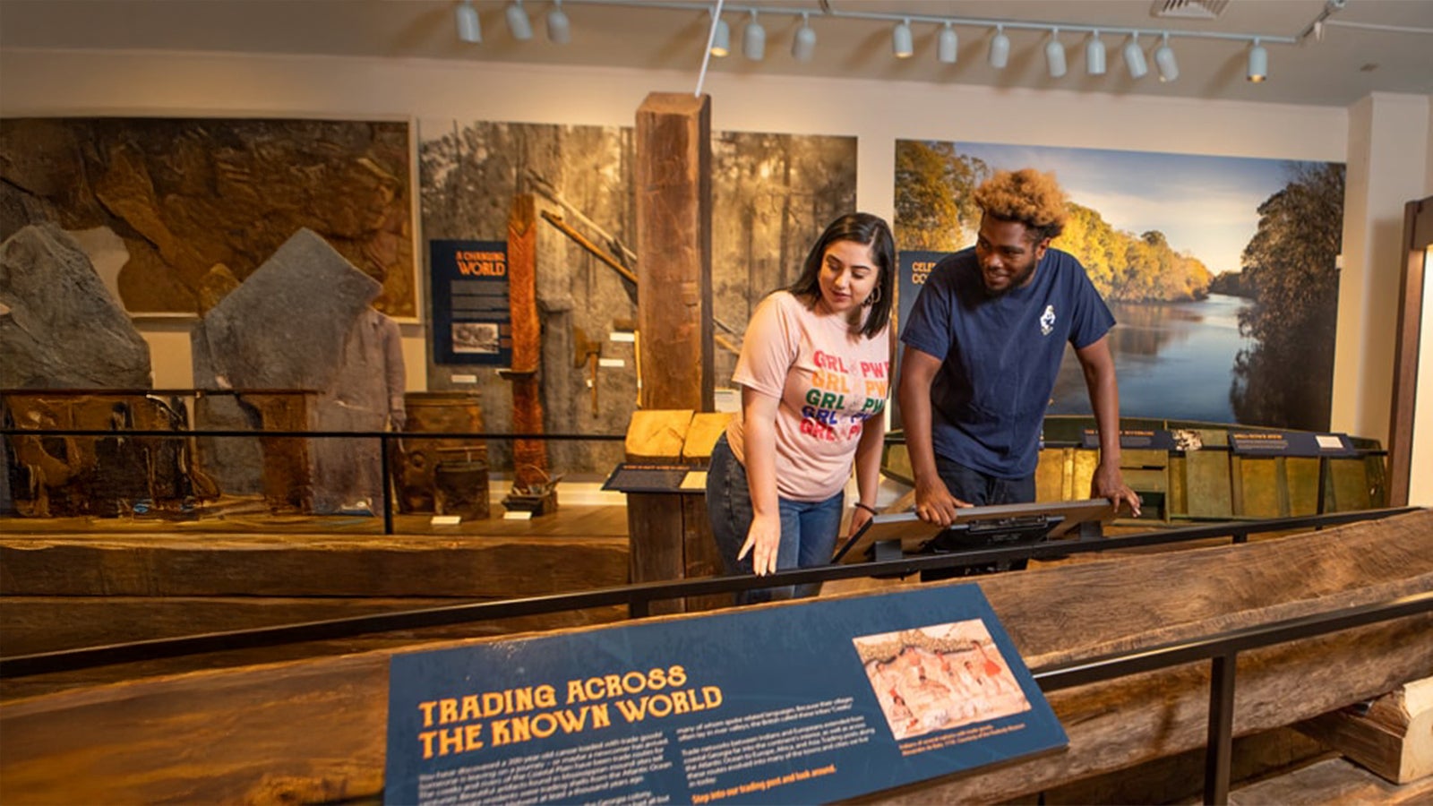 Visitors using an interactive display among Coastal Plain history exhibits inside the Georgia Southern University Museum.