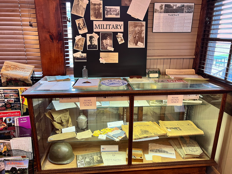 Military-history display case inside Warrenton's Museum of Cultural Heritage.