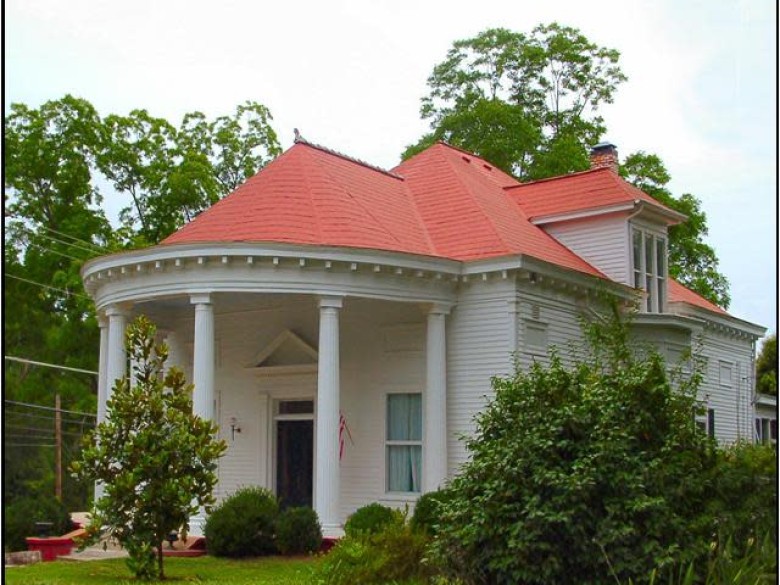 J. D. Persons House, a white historic home with a rounded red roof and columned porch