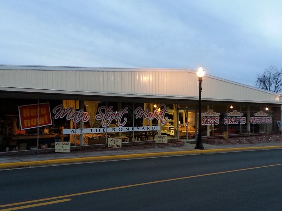 Main Street Market’s illuminated storefront and window displays in downtown Swainsboro.